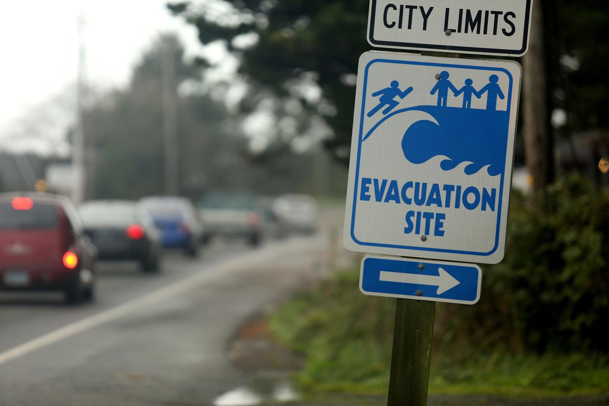 A Tsunami evacuation sign along Highway 101 Nov. 6, 2014, in Lincoln City, Oregon.