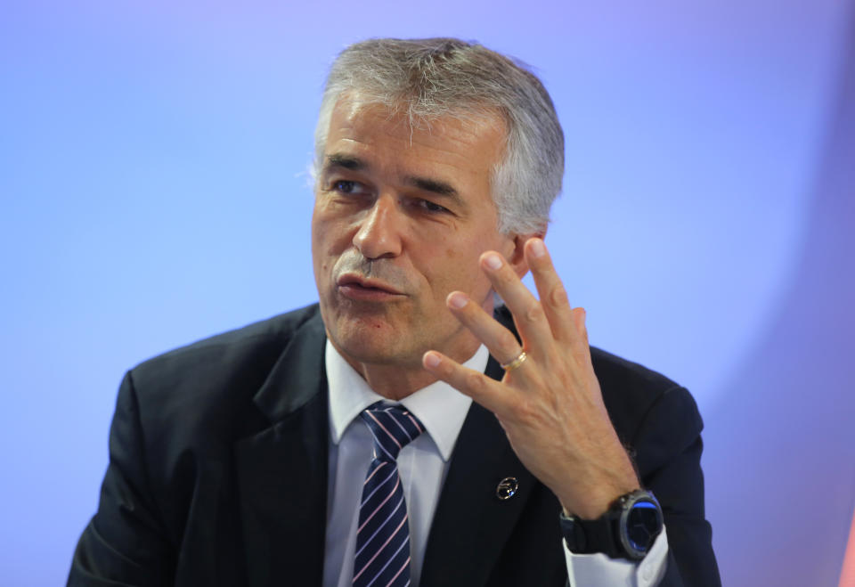 CEO of Citroen Vincent Cobee gestures a he speaks to the media during the presentation of the e-C4 all electric hatchback during a in Paris, Tuesday, June 30, 2020. PSA Group's Citroen Brand is showing off a new version of its C4 compact hatchback, a model that will be key to the company's sales prospects as it faces a highly competitive European car market that faces severe headwinds from the coronavirus. (AP Photo/Michel Euler)