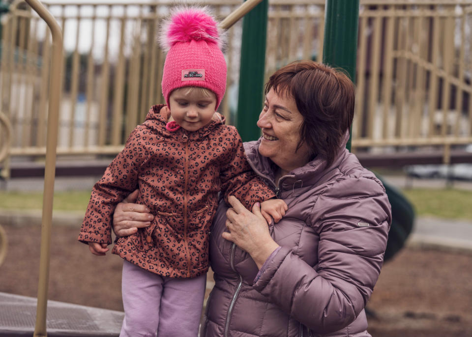 Anna, 2, standing with her grandmother at the playground across the street from her family’s new home in Westfield, Mass., on April 7. (Julian Spath / Lutheran Immigration and Refugee Service)