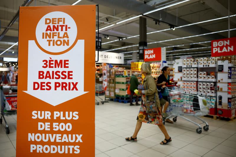 FILE PHOTO: Customers shop in a supermarket near Paris