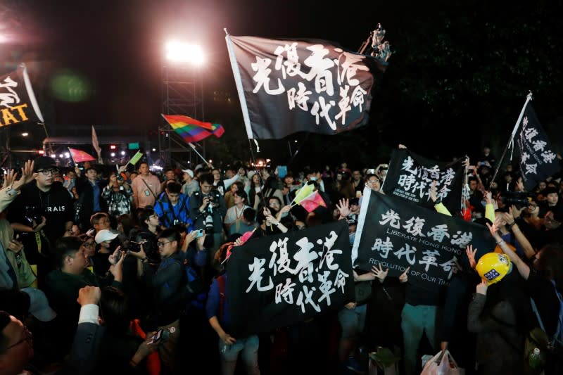 Hong Kong anti-government protesters attend a rally in support of Taiwan President Tsai Ing-wen outside the Democratic Progressive Party (DPP) headquarters in Taipei