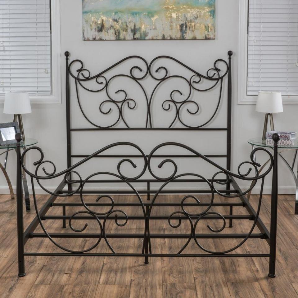 This dark bronze bed frame definitely goes with all the <a href="https://www.huffpost.com/entry/matte-black-home-decor-furniture-industrial-style_l_5f764b08c5b66377b27f86bf" target="_blank" rel="noopener noreferrer">matte black trend</a> we've been seeing recently. The scrollwork looks intricate and is actually made of iron. You're sure to have some sweet dreams on it. <a href="https://fave.co/2Fjlp64" target="_blank" rel="noopener noreferrer">Originally $435, get it now for $334 at The Home Depot</a>.