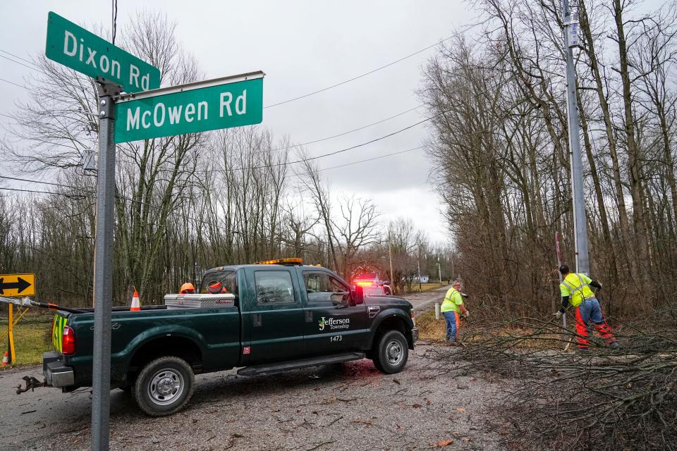 Feb 28, 2024; Pataskala, Ohio, USA; Jefferson Township employees Jack Neville and Nate Matthews work to clear trees off the roads after a potential tornado touched down in the early morning.
