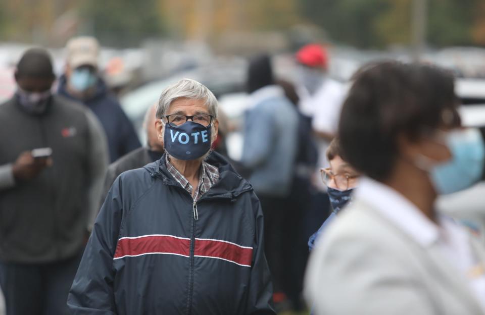 Ramapo residents line up outside the town hall to cast their votes early on Saturday, October 24, 2020. 