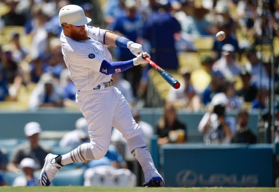 Los Angeles Dodgers' Justin Turner hits a two-run home run during the third inning of an MLB baseball game against the New York Yankees in Los Angeles, Saturday, Aug. 24, 2019. (AP Photo/Kelvin Kuo)