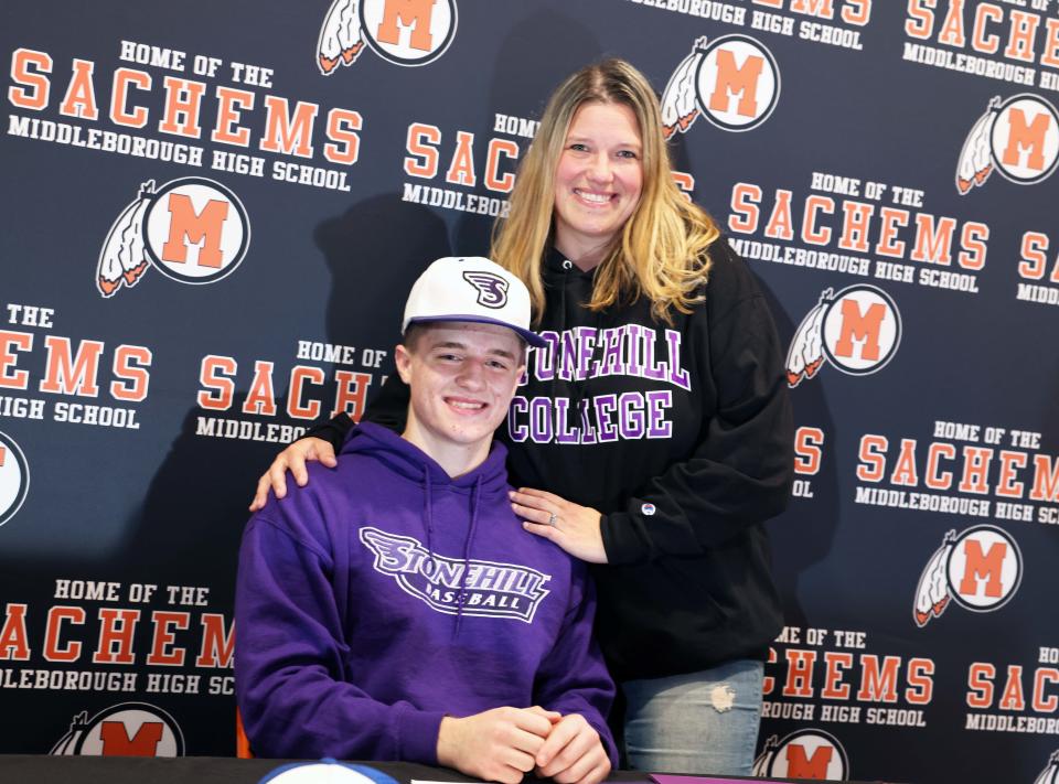 Middleboro senior Justin Tullish signs his letter of intent to play baseball at Stonehill College in a ceremony at Middleboro High School on Wednesday, Nov. 16, 2022. Tullish, was joined by his parents (Jay and Sandra), siblings (Nate, Ryan and Payton),  coaches Josh Porter and Mike Bruemmel, athletic director Ryan Sylvia and school principal Paul Branagan. 