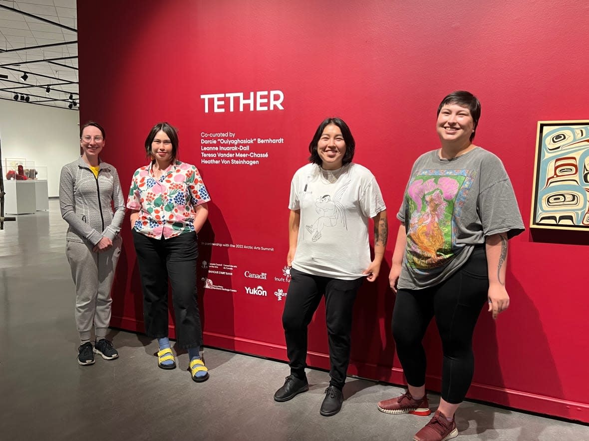'Tether,' an exhibition of works by northern Indigenous artists, is at the Yukon Arts Centre in Whitehorse as part of next week's Arctic Arts Summit. The shows four curators are, from left, Teresa Vander Meer-Chasse, Leanne Inuarak-Dall, Darcie 'Ouiyaghasiak' Bernhardt, and Heather Von Steinhagen. (Paul Tukker/CBC - image credit)