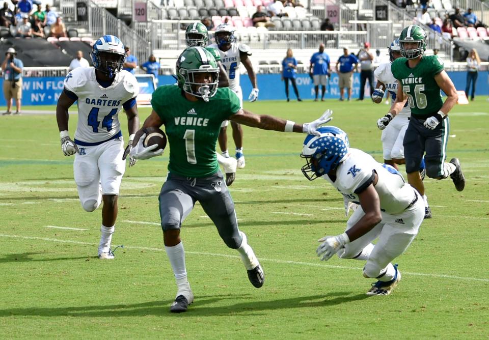 Venice High wide receiver Jayshon Platt tries to avoid Apopka defenders in the first half. Venice High met Apopka High Saturday afternoon in the FHSAA Class 8 state championship at DRV PNK Stadium in Ft. Lauderdale