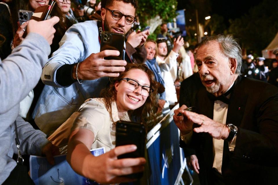 Francis Ford Coppola poses for pictures with fans (AFP via Getty Images)