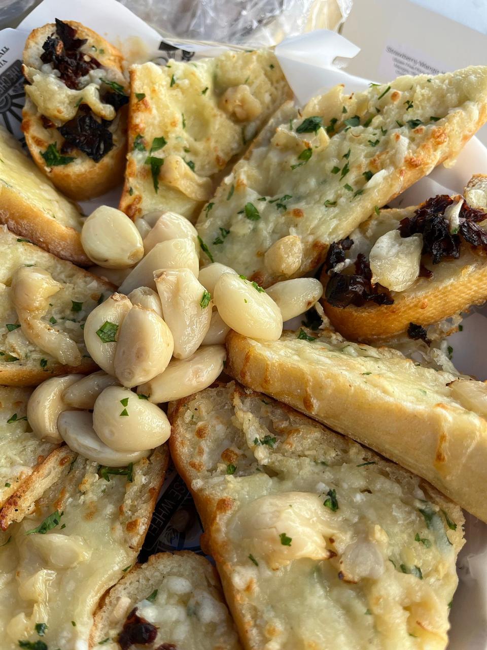The Cheese Wheel Village Market will have special garlic bread at Tiverton Farmers Market's inaugural Garlic Roast on Oct. 15, 2023.
