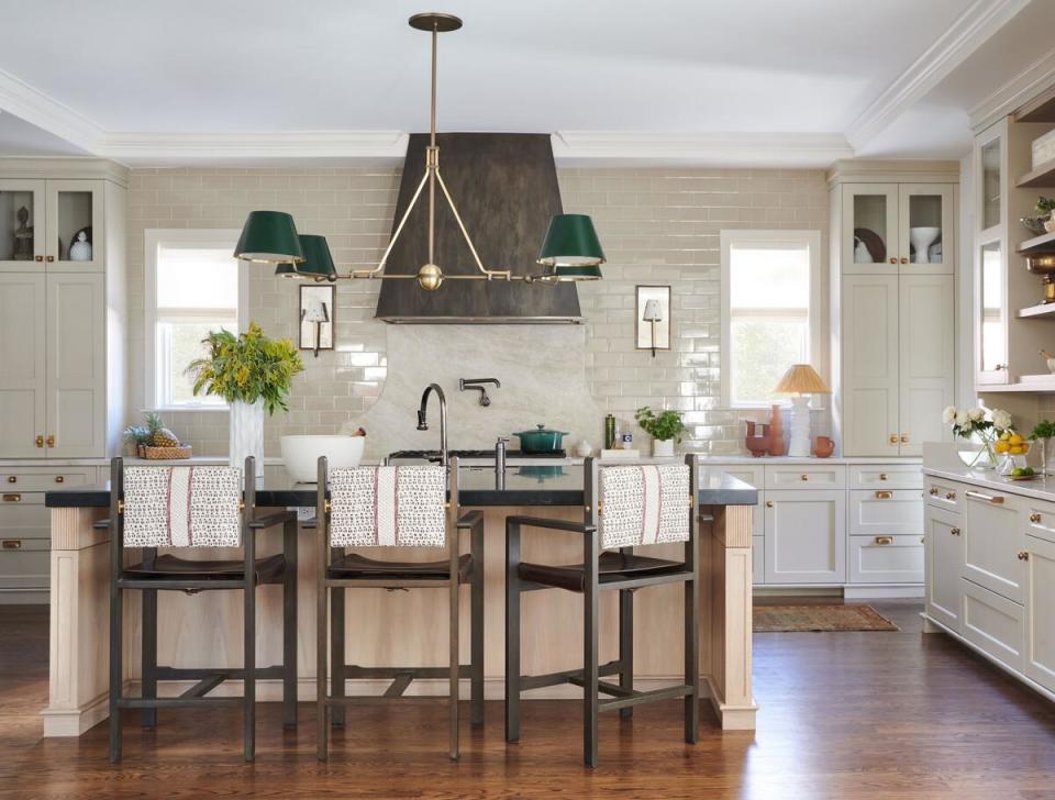 In a warm, welcoming kitchen, a fluted detail elevates the island