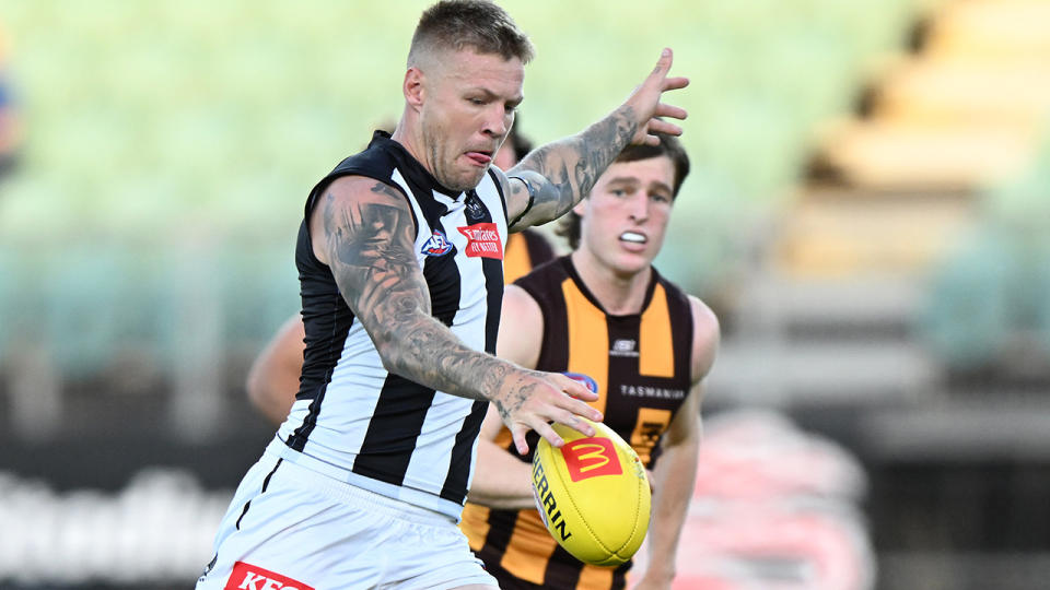 Jordan de Goey kicks the ball during an AFL pre-season match against Hawthorn.