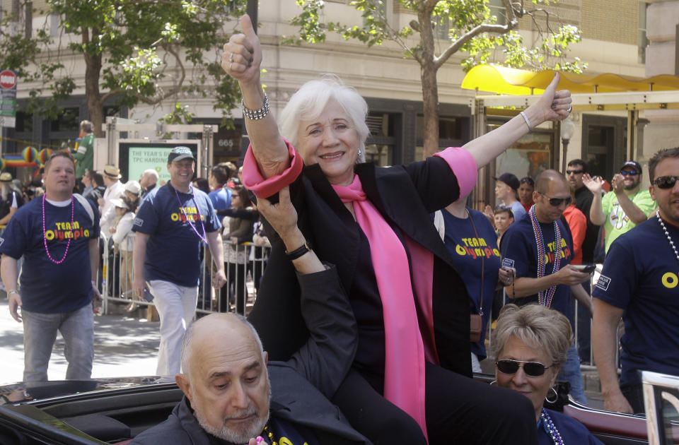 FILE - In this June 26, 2011 file photo, Actress Olympia Dukakis, a celebrity Grand Marshall for the 41st annual Gay Pride parade, waves to the crowd while being driven past them in San Francisco. Olympia Dukakis, the veteran stage and screen actress whose flair for maternal roles helped her win an Oscar as Cher’s mother in the romantic comedy “Moonstruck,” has died. She was 89. (AP Photo/Jeff Chiu, File)