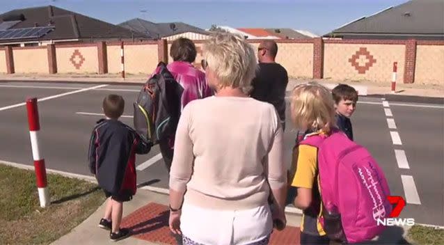 Parents, children waiting to cross. Source: 7News