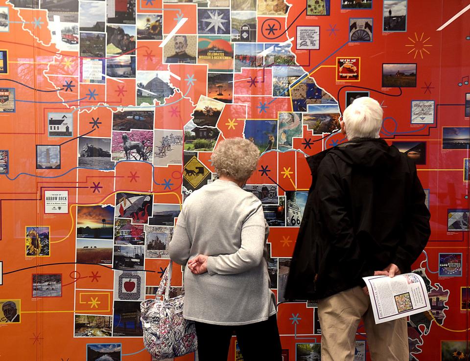 Willie Morris and her husband, Steve Morris, look at a display featuring all 114 counties in Missouri on Tuesday at the State Historical Society of Missouri Center for Missouri Studies. Willie created the Boone County quilt patch for the Missouri quilt on display at the center.