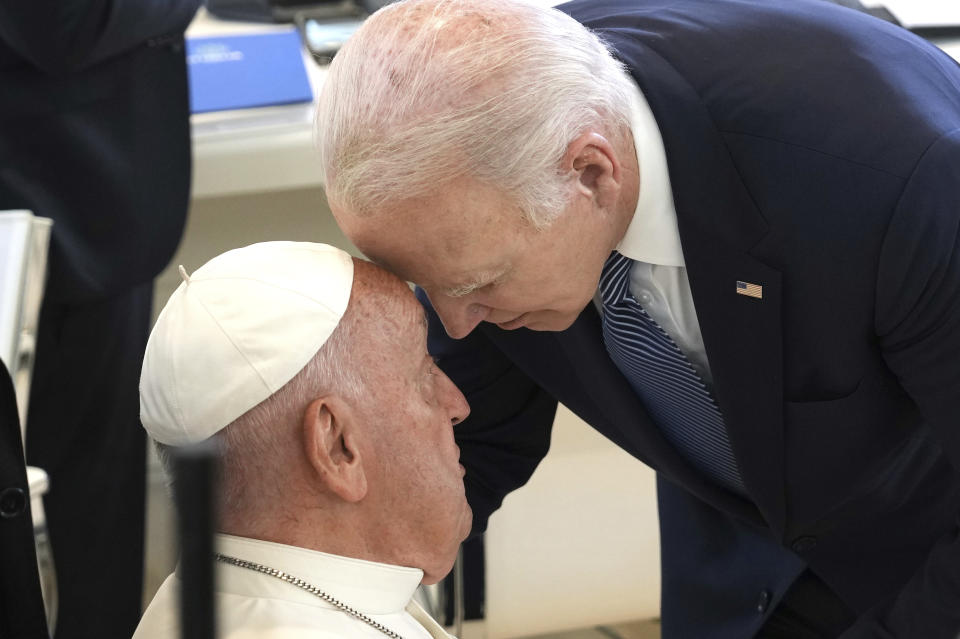 U.S. President Joe Biden, right, greets Pope Francis ahead of a working session on Artificial Intelligence (AI), Energy, Africa-Mediterranean, on day two of the 50th G7 summit at Borgo Egnazia, southern Italy, on Friday, June 14, 2024. (Christopher Furlong/Pool Photo via AP)