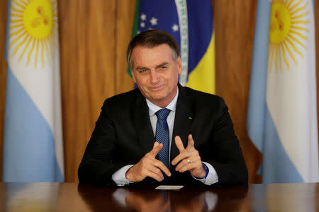 Brazil's President Jair Bolsonaro gestures during a meeting with Argentina's President Mauricio Macri, at the Planalto Palace in Brasilia, Brazil January 16, 2019. REUTERS/Ueslei Marcelino/Files