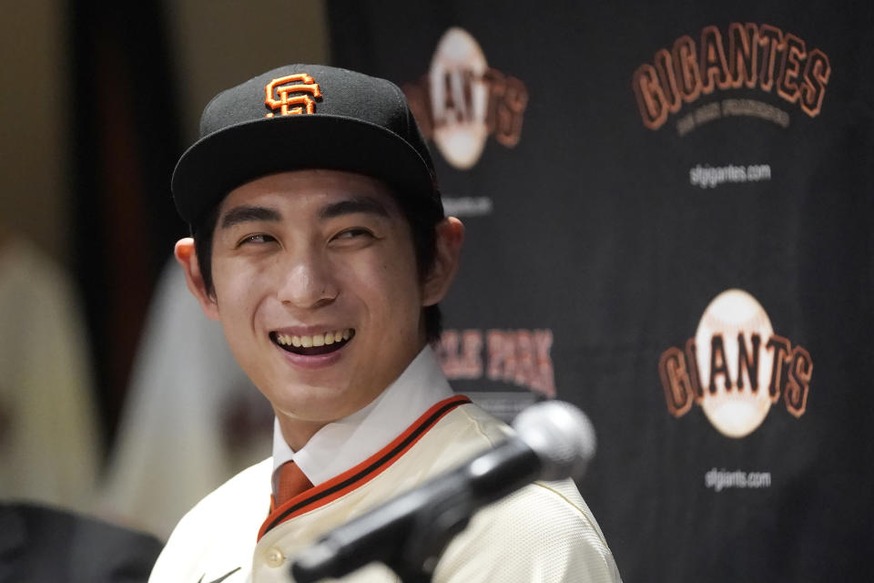 San Francisco Giants' Jung Hoo Lee smiles during a baseball news conference in San Francisco, Friday, Dec. 15, 2023. (AP Photo/Jeff Chiu)