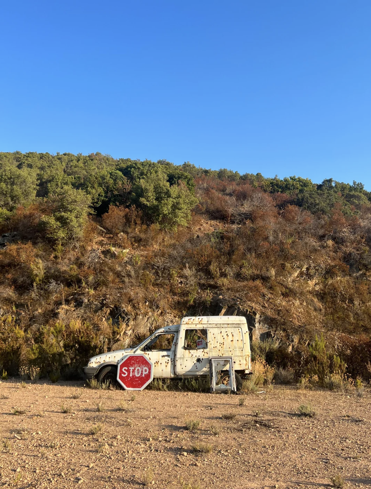 A van covered in bullet holes