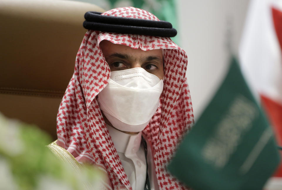 Saudi Foreign Minister Prince Faisal bin Farhan Al-Saud wears a face mask to help curb the spread of the coronavirus as he speaks at a press conference during the 41st Gulf Cooperation Council (GCC) in Al-Ula, Saudi Arabia, Tuesday, Jan. 5, 2021. (AP Photo/Amr Nabil)