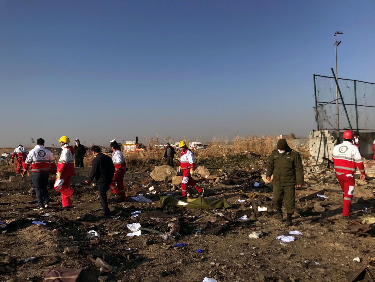 Rescuers team check the debris from a plan crash belonging to Ukraine International Airlines after take-off from Iran's Imam Khomeini airport, on the outskirts of Tehran, Iran January 8, 2020. Nazanin Tabatabaee/WANA (West Asia News Agency) via REUTERS ATTENTION EDITORS - THIS IMAGE HAS BEEN SUPPLIED BY A THIRD PARTY