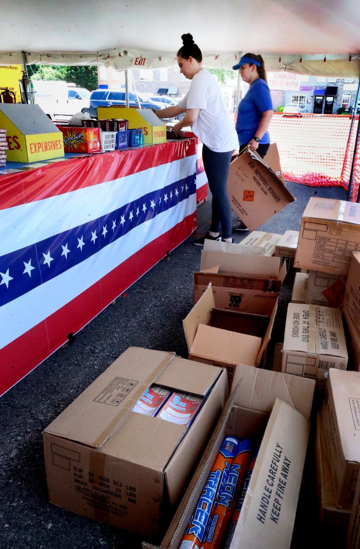 Niki Bornot, left and Audrey Harrington, right, work to set up a firework stand off of Veterans parkway on Tuesday, June 27, 2023. Fireworks stands in the Murfreesboro city limits are allowed to open on Wednesday.