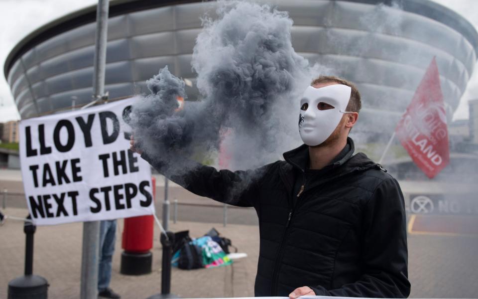 Extinction Rebellion protesters outside the Lloyds AGM in Glasgow - James Chapelard