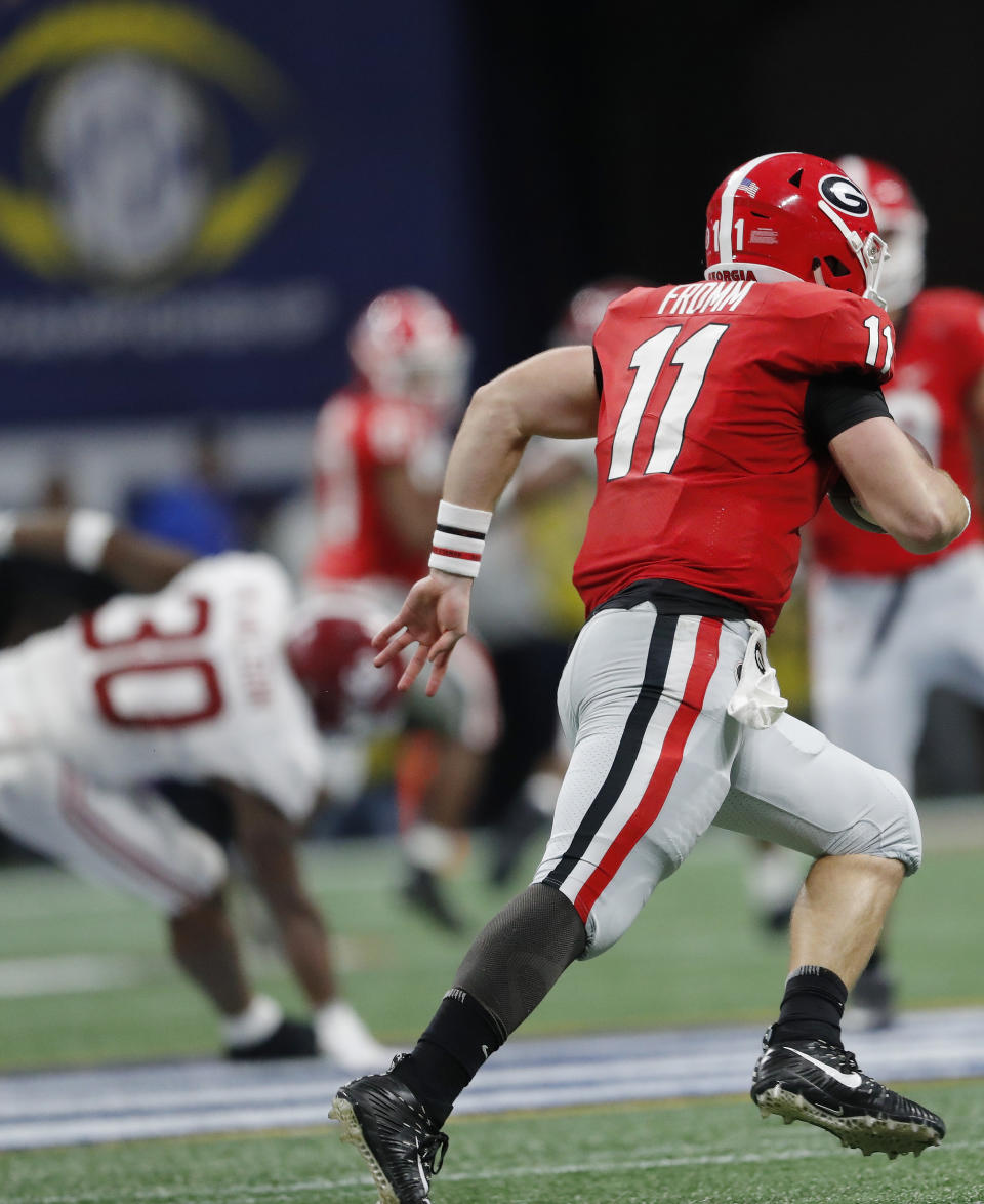 Georgia quarterback Jake Fromm (11) runs against Alabama during the second half of the Southeastern Conference championship NCAA college football game, Saturday, Dec. 1, 2018, in Atlanta. (AP Photo/John Bazemore)