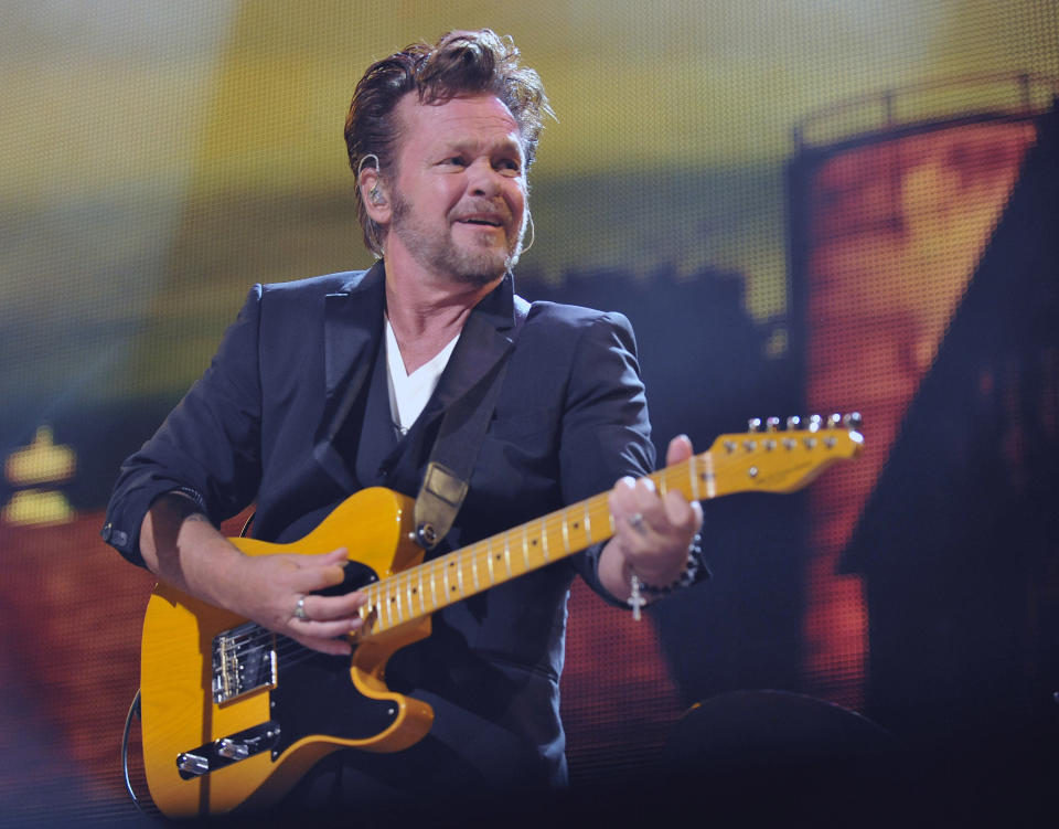 FILE - In this Sept. 21, 2013 file photo, John Mellencamp performs in Saratoga Springs, N.Y. Mellencamp, a liberal rocker, wants conservative Wisconsin Republican Gov. Scott Walker to know he supports union rights and says Walker should think about that before using his songs on the campaign trail.(AP Photo/Hans Pennink, File)