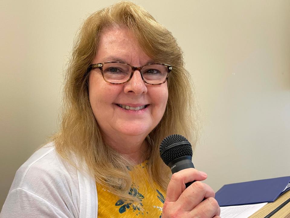 Karns Senior Center Coordinator Robyn Trostle makes a few announcements at the luau at Karns Senior Center Tuesday, June 7, 2022.