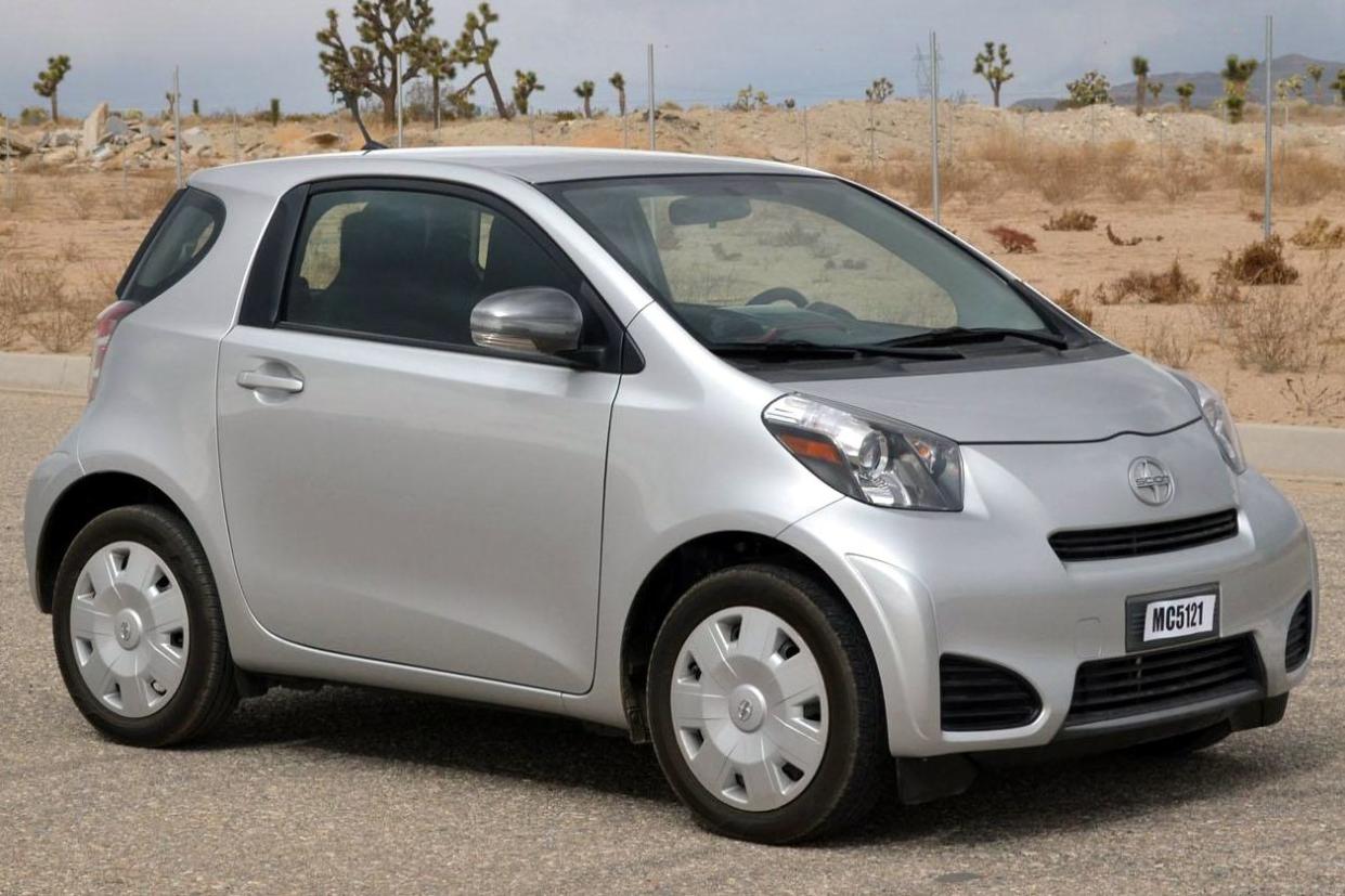 Silver Scion iQ parked outside in desert