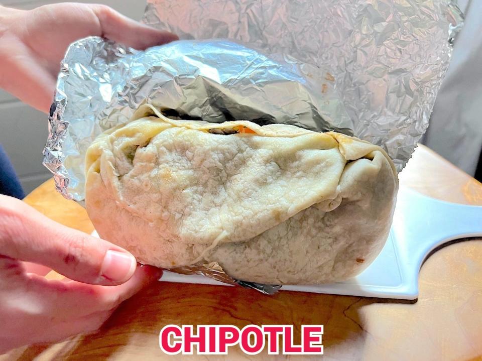 An unwrapped Chipotle burrito.