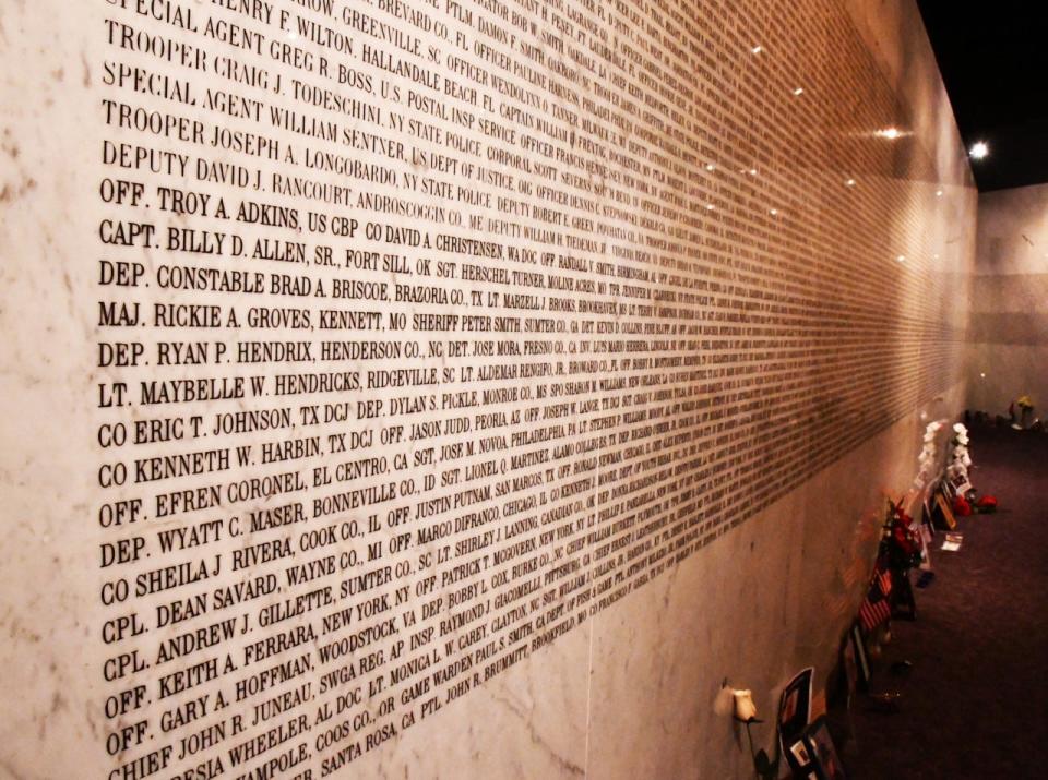 The bottom third of this wall in the Memorial Rotunda at American Police Hall of Fame & Museum in Titusville lists the names of the 374 officers who died in the line of duty in 2020. Of those, 245 were COVID-19-related deaths.