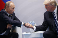 <p>President Donald Trump shakes hands with Russian President Vladimir Putin at the G20 Summit, Friday, July 7, 2017, in Hamburg, Germany. (Photo: Evan Vucci/AP) </p>