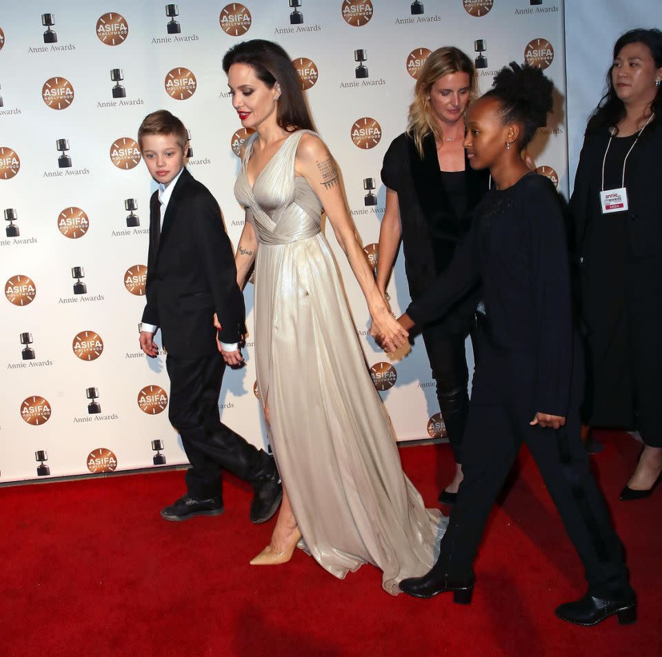 (L-R) Shiloh Nouvel Jolie-Pitt, actress Angelina Jolie and Zahara Marley Jolie-Pitt attend the 45th Annual Annie Awards at Royce Hall on February 3, 2018 in Los Angeles, California. Source: Getty