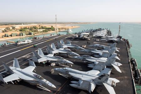 The US Navy aircraft carrier USS Harry S. Truman transits the Suez Canal, Egypt towards the Mediterranean Sea in a photo released by the US Navy June 2, 2016. U.S. Navy/Mass Communication Specialist 3rd Class Anthony Flynn/Handout via REUTERS