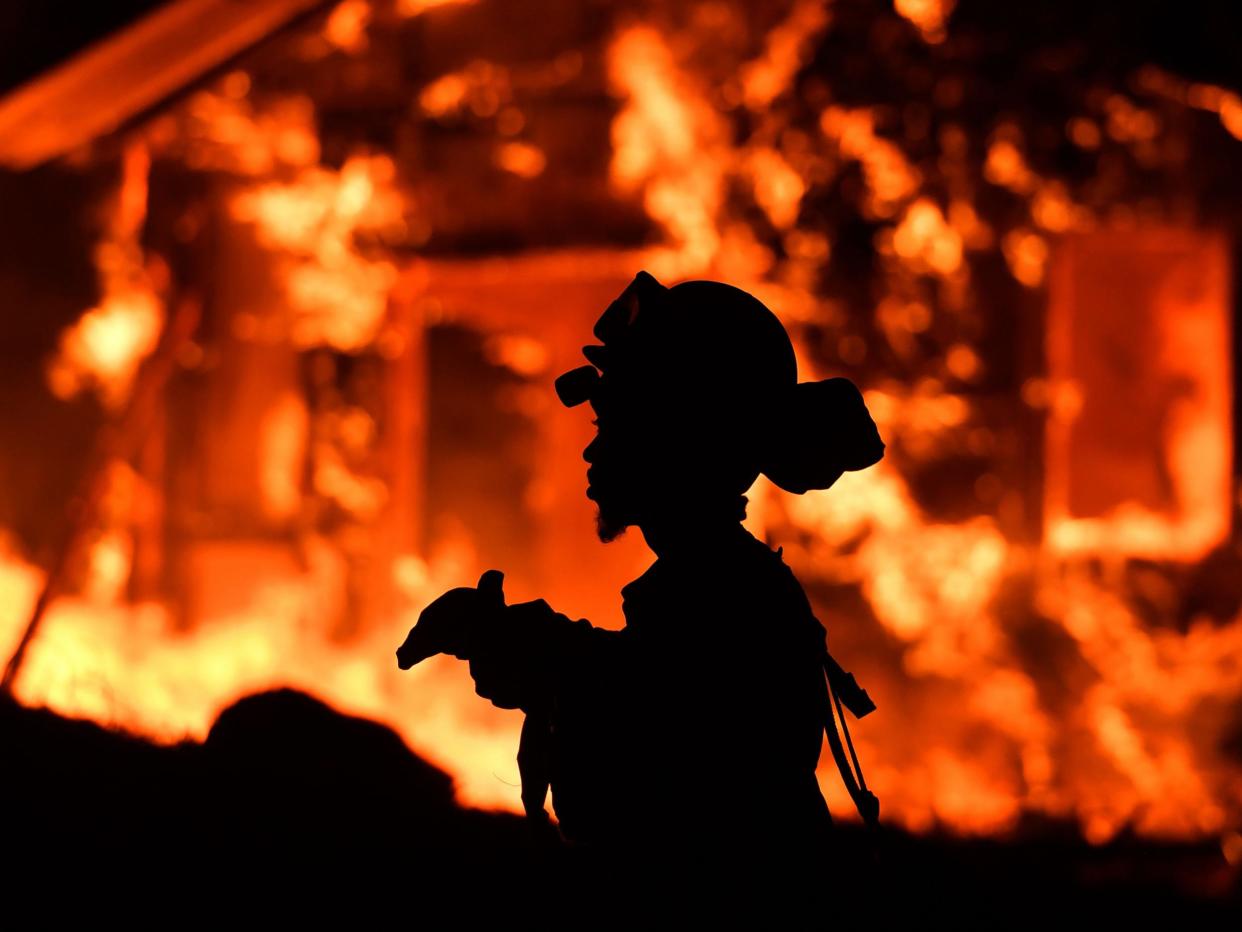 Firefighters are still battling to bring 16 remaining fires under control: Josh Edelson/AFP/Getty