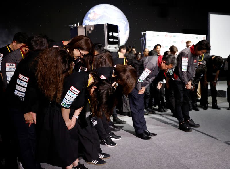 Employees of "ispace" bow their heads after the company announced they lost signal from the lander in HAKUTO-R lunar exploration program on the Moon at a venue to watch its landing in Tokyo