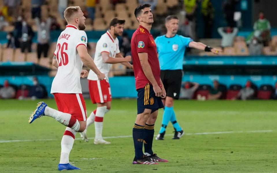 Gerard Moreno looks despondent after missing his spot kick - AFP