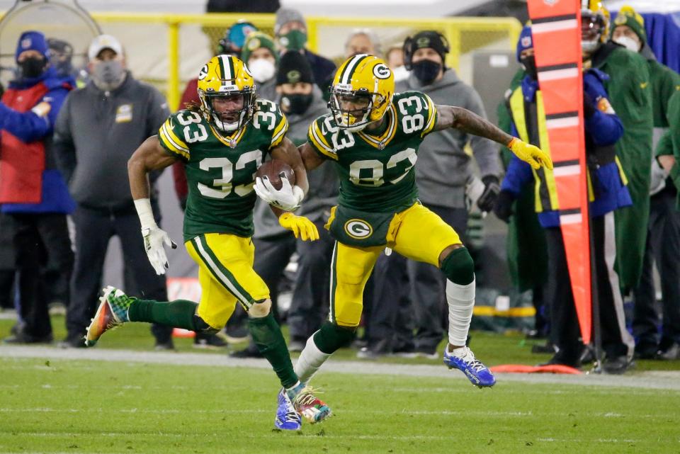 Green Bay Packers' Aaron Jones runs for a 77-yard touchdown during the second half of an NFL football game against the Philadelphia Eagles Sunday, Dec. 6, 2020, in Green Bay, Wis. (AP Photo/Mike Roemer)