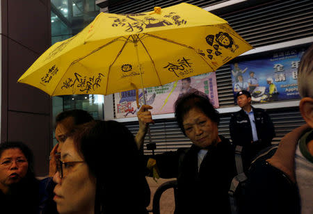 Pro-democracy protesters supporting Occupy Central movement demonstrate outside the police headquarters in Hong Kong, China March 27, 2017. REUTERS/Bobby Yip