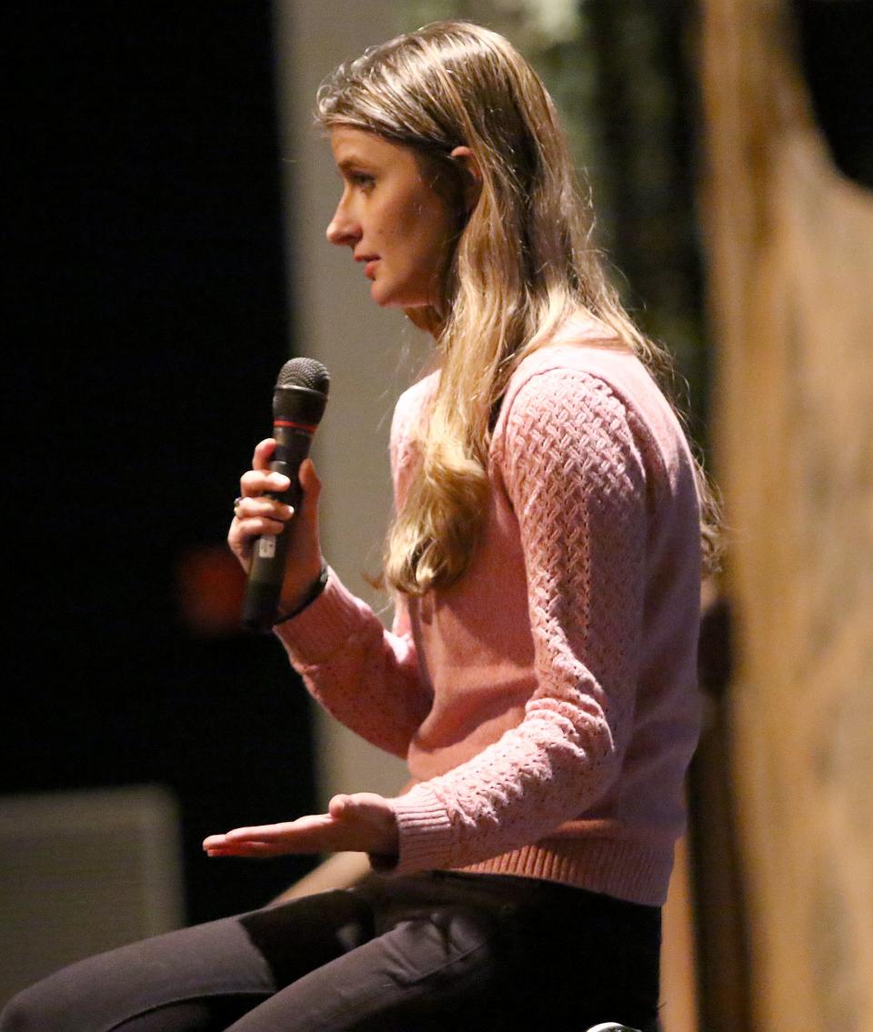 Alicia "Kozak" Kozakiewicz, a survivor of internet luring and abduction in 2002, speaks to parents inside the West Branch High School auditorium on Tuesday, March 21, 2023. About 50 people attended the event. Ed Hall Jr, Special To The Review