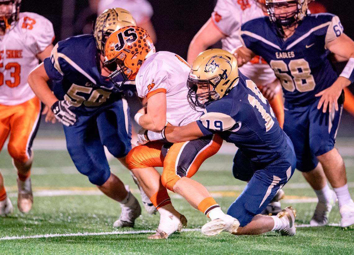 Bald Eagle Area’s Camron Watkins stops Jersey Shore’s Brady Jordan during the game on Friday, Oct. 22, 2021.