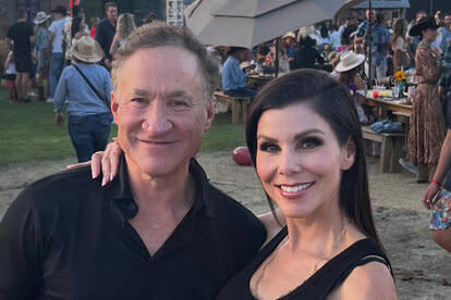 Heather and Terry smiling together outdoors.