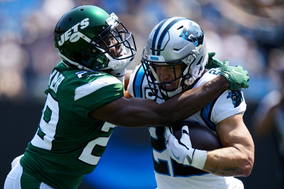 Carolina Panthers running back Christian McCaffrey is tackled by New York Jets free safety Lamarcus Joyner during the first half of an NFL football game Sunday, Sept. 12, 2021, in Charlotte, N.C. (AP Photo/Jacob Kupferman)