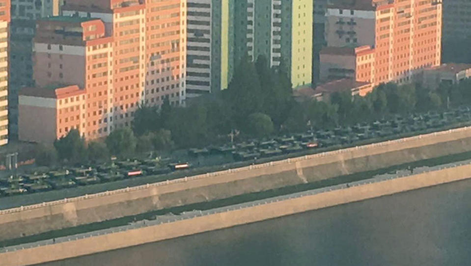 Military vehicles are seen along the Taedong River in Pyongyang, Sunday, Sept. 9, 2018. North Korea will stage a major military parade, huge rallies and reviving its iconic mass games on Sunday to mark its 70th anniversary as a nation. (Kyodo News via AP)