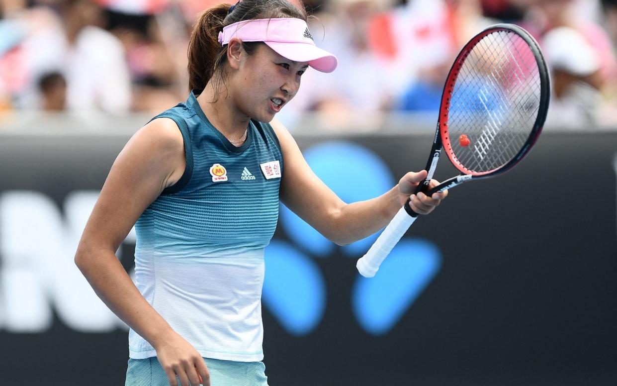 China's Peng Shuai reacts after a point against Canada's Eugenie Bouchard during their women's singles match on day two of the Australian Open in 2021 - AFP