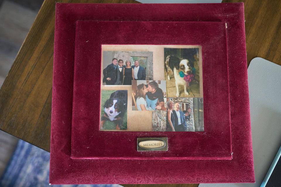 The cover of Tina Rodrigues' family photo album is shown on the kitchen table of her Goodyear home on March 6, 2023.