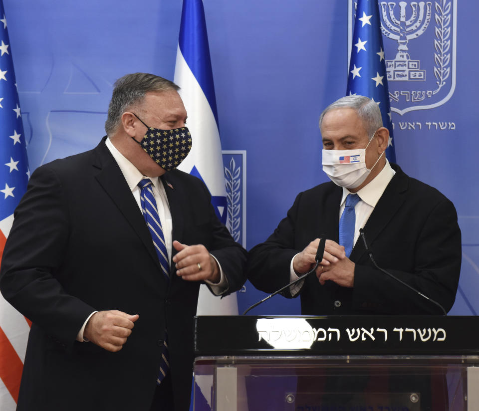 U.S. Secretary of State Mike Pompeo and Israeli Prime Minister Benjamin Netanyahu wear face masks to help prevent the spread of the coronavirus after they make joint statements to the press, in Jerusalem, Monday, Aug. 24, 2020. (Debbie Hill/Pool via AP)