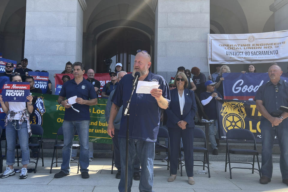 California union leaders, truck drivers and lawmakers rally outside the state Capitol in Sacramento, Calif., Tuesday, Sept. 19, 2023. They are demanding that Democratic Gov. Gavin Newsom sign a bill that would require self-driving semi-trucks to have a human present as they are tested on public roads for their safety. (AP Photo/Sophie Austin)